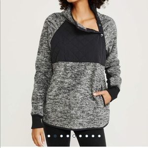 Asymmetrical snap-up fleece